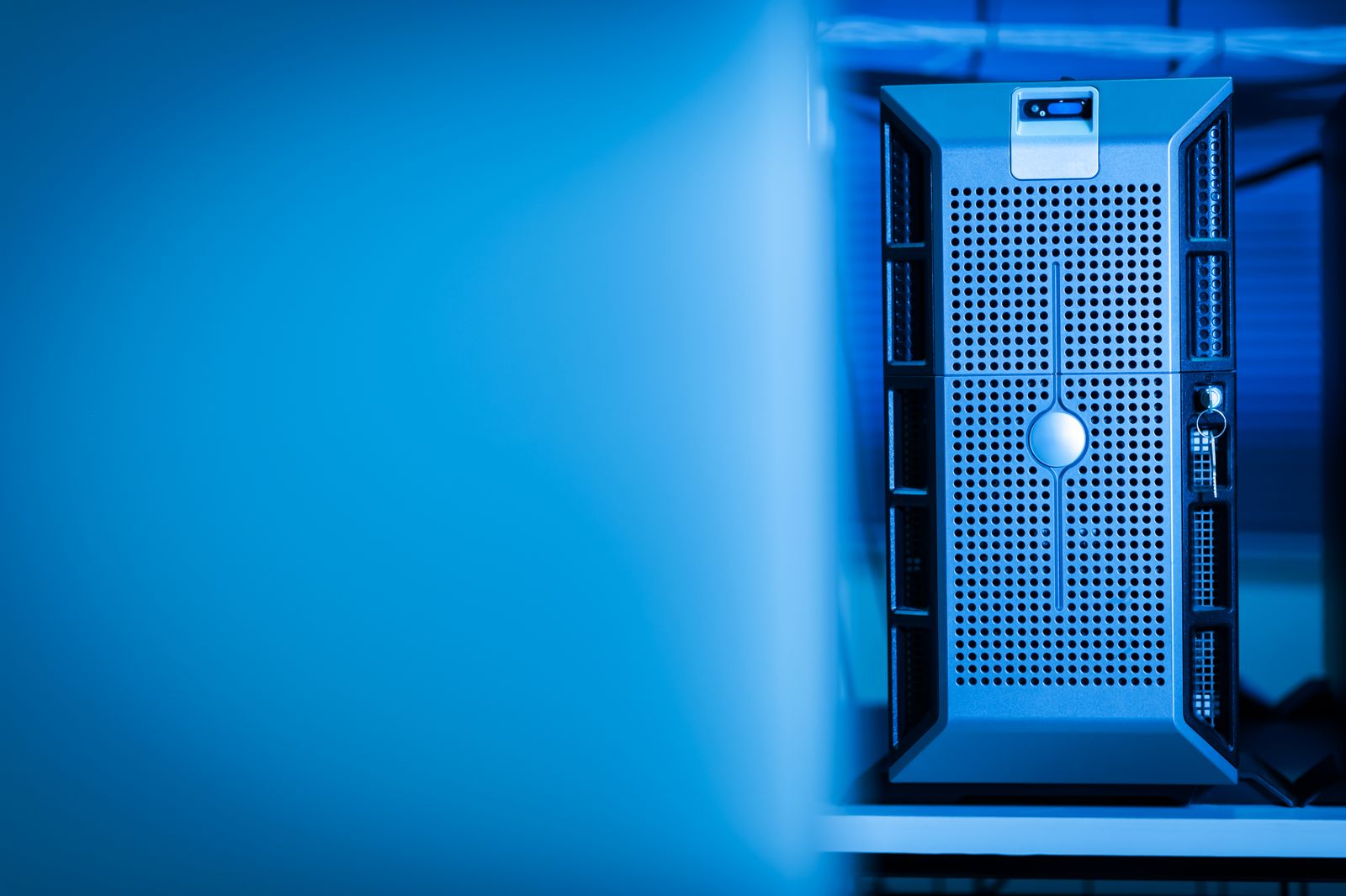 Unbranded server hardware in a blue-lit data centre